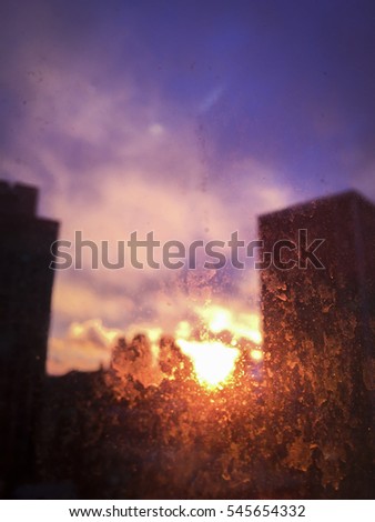 Sunset through a dirty New York City office window - abstract background