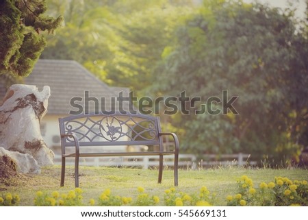 Empty chair, bench in nature park, vintage toned style