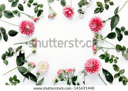 Round frame with pink flower buds, branches and leaves isolated on white background. lay flat, top view