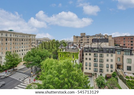 A view of America Capital Washington DC from a rooftop showing both historical and modern buildings under blue sky