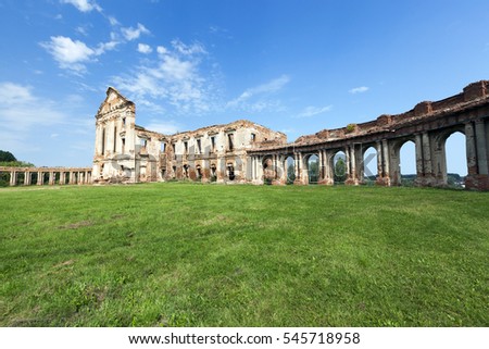  ruins of the castle in the village Ruzhany, the territory of the Republic of Belarus. Summer season. In the background, blue sky, on the earth grows green grass. Palace of the 17th century.