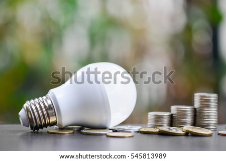 LED Bulb and Coin stack - Saving concept