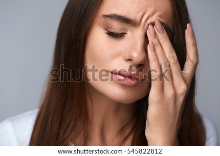 Pain. Tired Exhausted Stressed Woman Suffering From Strong Eye Pain. Portrait Of Beautiful Young Female Feeling Sick, Having Headache, Nose Pain And Touching Painful Eyes. Healthcare. High Resolution Royalty-Free Stock Photo #545822812
