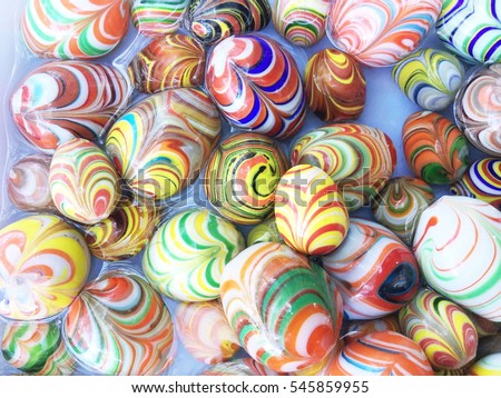 Background of colorful onyx stone eggs of different colors