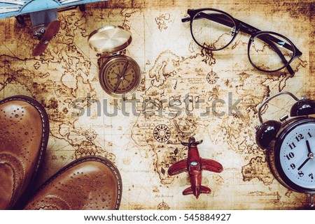 Overhead view of Traveler's accessories, Essential vacation items, Travel concept background, vintage background, love story, selective focus, save money to see the world