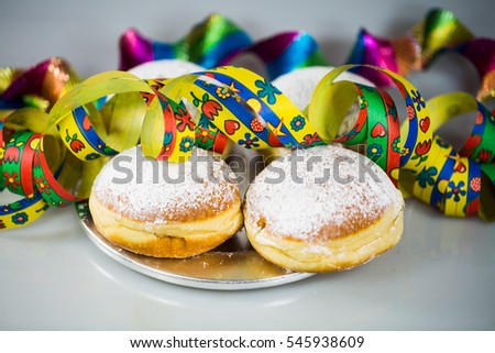 Donut for carnival, New Year's Eve, colorful hats, streamers