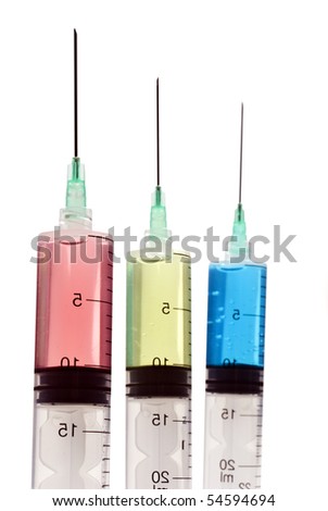 Three syringes with needles on a white background with space for text - focus on the middle needle