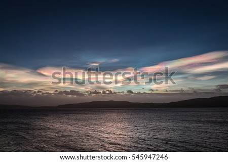 Polar stratospheric cloud, also known as nacreous clouds from nacre, or mother of pearl, due to its iridescence). Royalty-Free Stock Photo #545947246
