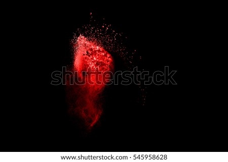 Abstract art colored powder on black background. Movement frozen colored dust explosion multicolored on black background.