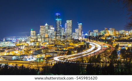 Seattle cityscape at night with traffic light on freeway,Washington,usa.