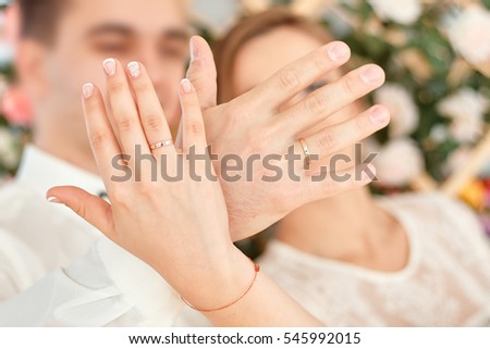 Wedding couples hands with wedding rings on fingers