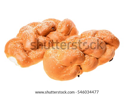 Two bright shabbat challah wih seeds isolated on white background