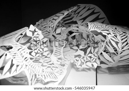 Voronoi diagram laser cut into paper and folded to create a three dimensional architectural model Royalty-Free Stock Photo #546035947