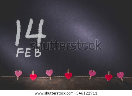 Heart Hanging and Fourteen Date Paint on Background with Copy Space in Valentine Day