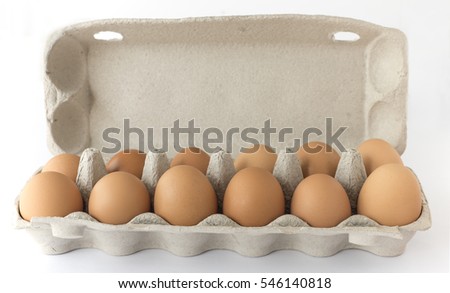 Carton of twelve brown free range hen laid eggs. Royalty-Free Stock Photo #546140818