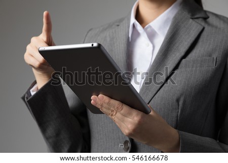 Woman operates tablet PC, internet, mail, browsing
