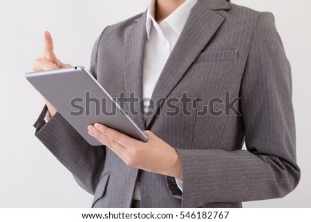 Woman who operates tablet PC, internet, mail, browsing