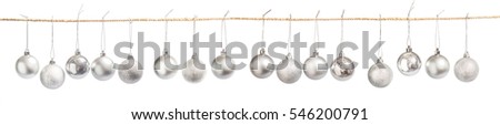 Christmas balls hanging on rope isolated on white
