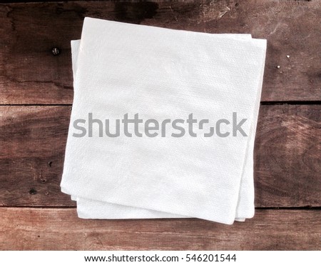 Tissue paper white color on wooden background Royalty-Free Stock Photo #546201544