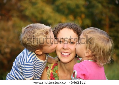 children kiss the mother