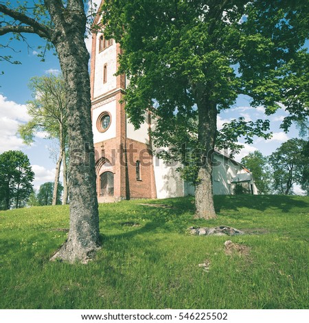 countryside church building in summer in small village - instant vintage square photo