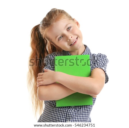 Cute little girl with green book on white background