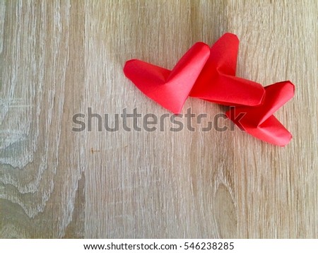 Red paper hearts Isolated on a wooden floor background. You can use as Greeting Card for Valentines Day "Happy Birth Valentines Day'"
