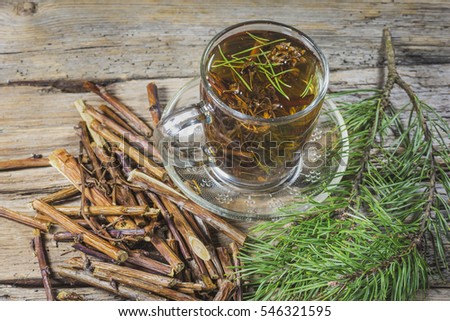 Useful tea from dry branches raspberries and pine needles Royalty-Free Stock Photo #546321595