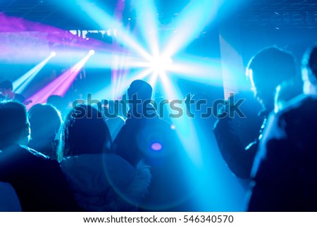 Rock stage, light and enthusiastic audience