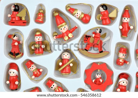 Set of colorful vintage Christmas toys for kids. A full box with miniature playthings. Santa's gift bag full of gifts over white. Box of toys. Cartoon figure isolated. Wooden toys and dolls. 