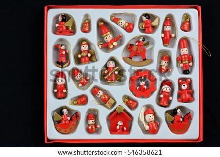 Set of colorful vintage Christmas toys for kids. A full box with miniature playthings. Santa's gift bag full of gifts over white. Box of toys. Cartoon figure isolated. Wooden toys and dolls. 