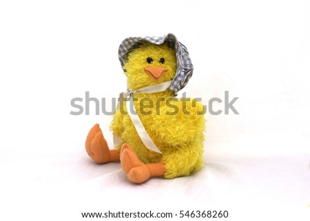 white stuffed animal duck toy on a white background .
