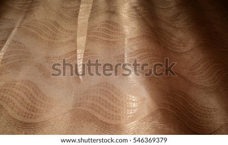 Beautiful background of brown curtains in the apartment