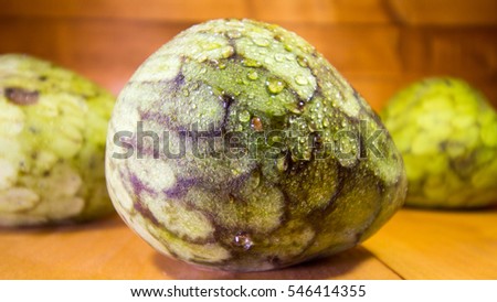 Ripe Cherimoya fruit with two others in the background, ready for healthy breakfast.