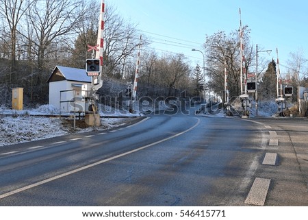 Railroad crossing with gates and traffic lights