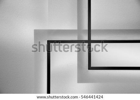 Close-up of matte glass doors or transparent partitions with plastered wall behind them. Modern interior / architecture fragment. Abstract black and white background.