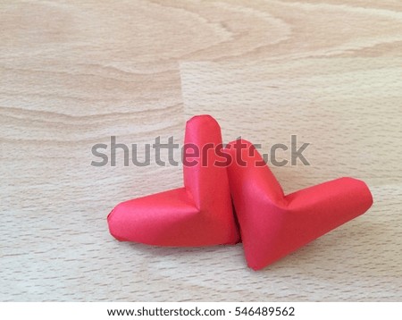 Two paper red hearts isolated on wood background. You can use for greeting card for Valentine's Day with Text [Happy Valentine's Day]