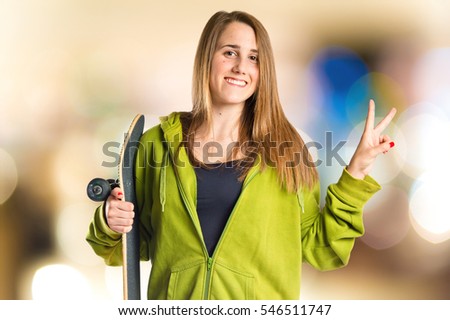 Girl with thumb up on unfocused background