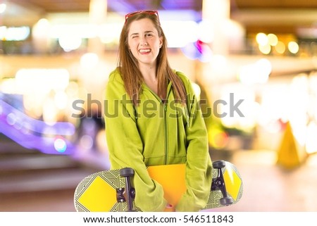 Blonde girl with skate on unfocused background