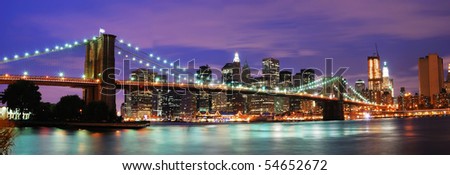 New York City Brooklyn bridge and Manhattan skyline night scene over Hudson River