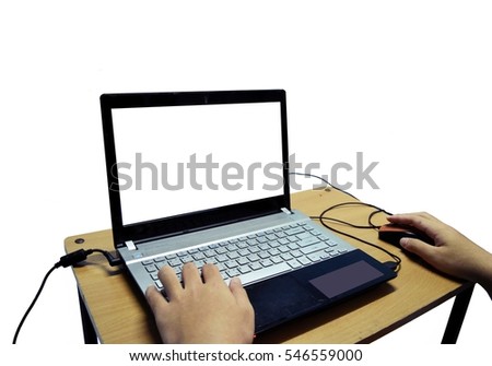 Human hand  typing on keyboard Thai and English letters  on generic laptop at table ,Using a notebook computer  isolated on white background, Work from home when quarantine for Covid - 19