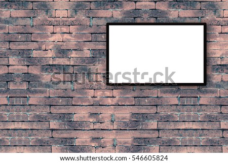 blank black picture frame on the old brick wall with copy space for moc up your product display 
