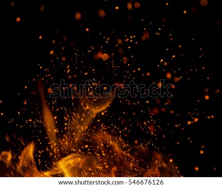 fire flames with sparks on a black background Royalty-Free Stock Photo #546676126