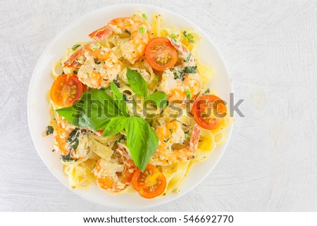 delicious italian pasta with shrimp on plate closeup