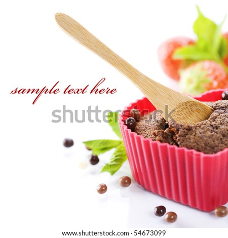 chocolate heart shape muffin in red silicone mold, fresh strawberry and mint (with sample text)