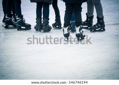 Seven young people standing on ice