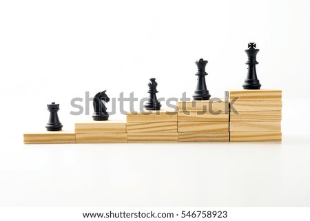 Chess on wooden blocks.