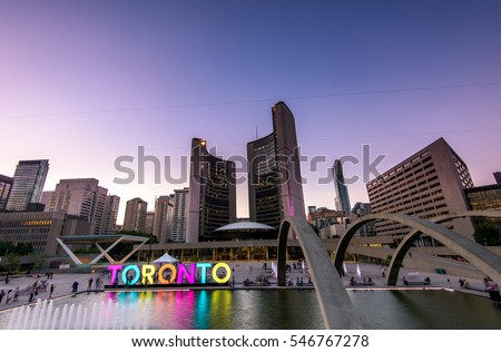 Toronto city hall and Toronto Sign in downtown at twilight, in Toronto, Ontario, Canada