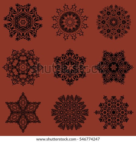 Vector Christmas theme. Set of 9 winter New Year snowflakes on a brown background.