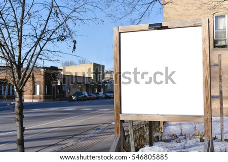 blank sign post by street in town, with clipping path. 
